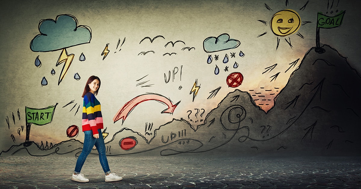 Woman walking a path with multiple obstacles to reach the goal.